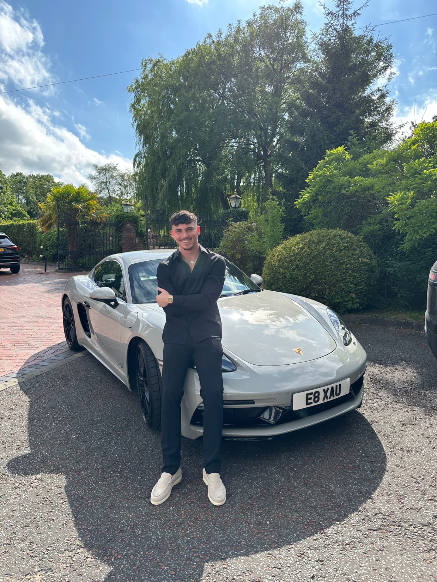 Ed with the sports car he bought from trading profits